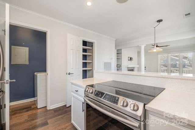 kitchen featuring electric range, visible vents, dark wood-style flooring, and ornamental molding