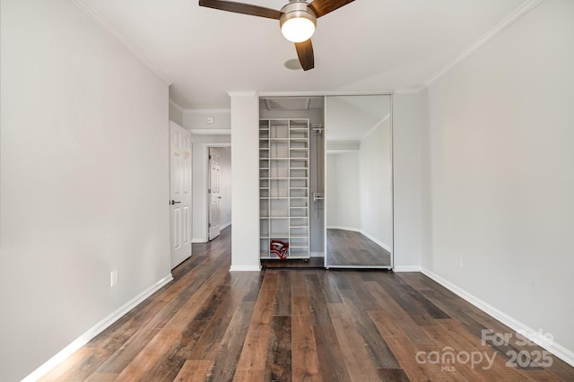 unfurnished bedroom featuring baseboards, ornamental molding, a ceiling fan, and hardwood / wood-style flooring