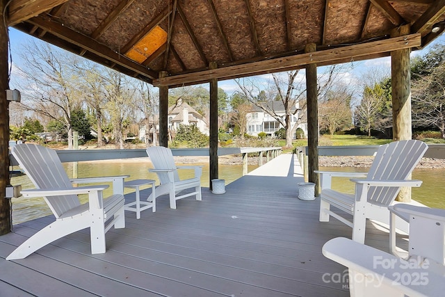 wooden deck featuring a water view