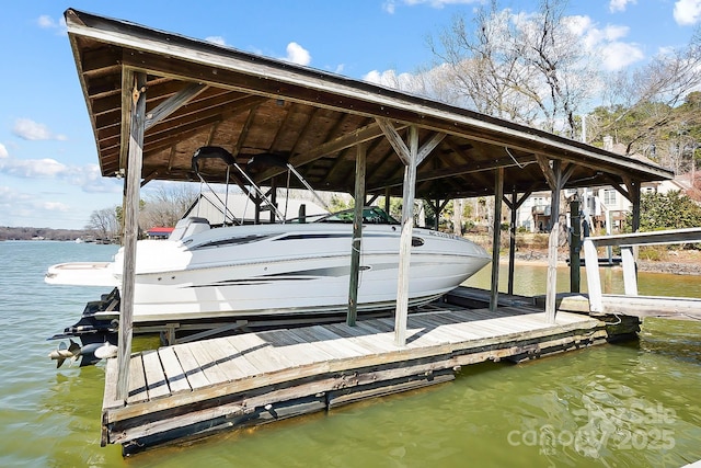 dock area featuring a water view and boat lift