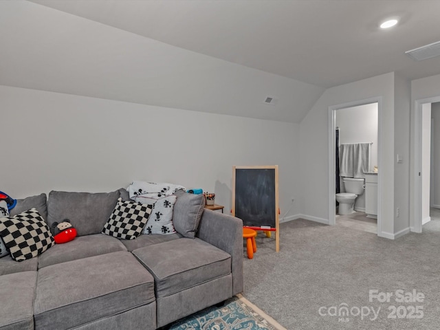 living room featuring visible vents, carpet flooring, baseboards, and vaulted ceiling