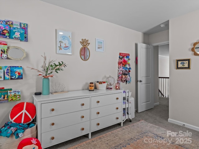 carpeted bedroom featuring baseboards