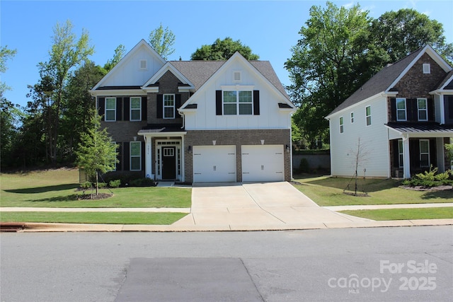 traditional-style home with board and batten siding, brick siding, a front yard, concrete driveway, and an attached garage