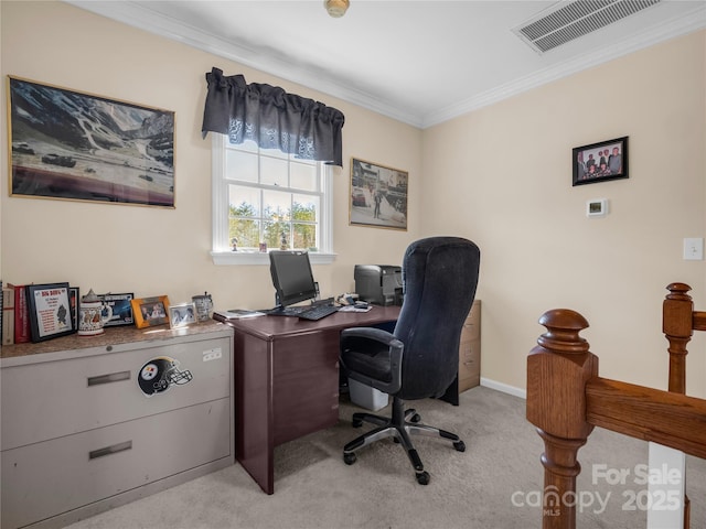office space with visible vents, light carpet, baseboards, and crown molding