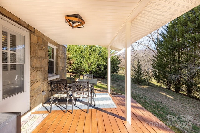 wooden deck with outdoor dining area