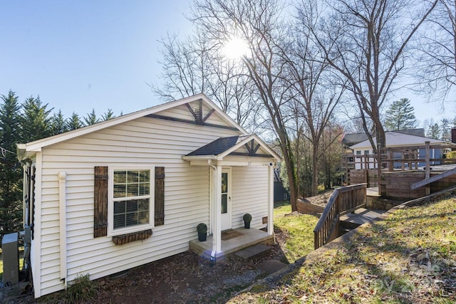 rear view of property with a deck