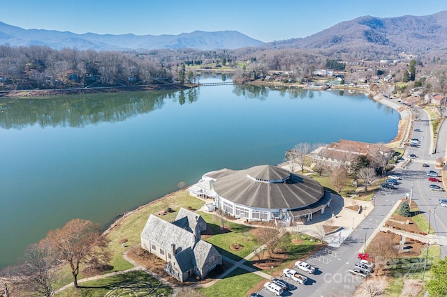 aerial view featuring a water and mountain view