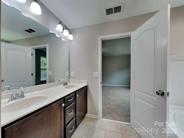 full bath featuring a sink, visible vents, and tile patterned floors