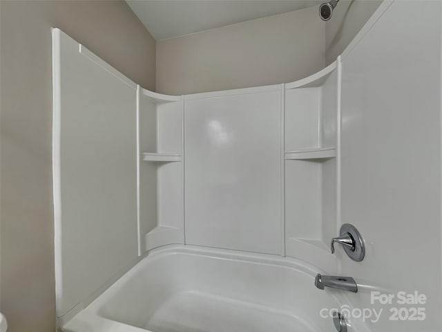 bathroom with bathing tub / shower combination