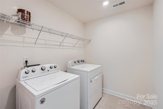 laundry room with visible vents, washer and clothes dryer, recessed lighting, baseboards, and laundry area