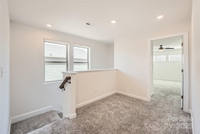 carpeted empty room with recessed lighting, visible vents, baseboards, and ceiling fan