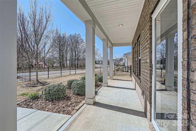 view of patio / terrace featuring fence