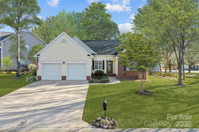 view of front of home featuring a front yard, concrete driveway, and a garage