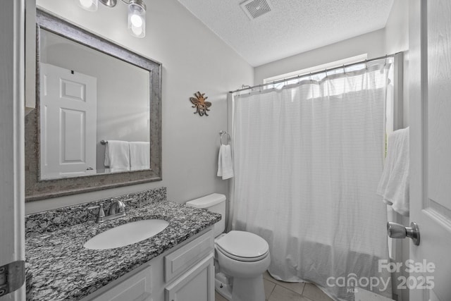 full bath featuring tile patterned floors, visible vents, toilet, a textured ceiling, and vanity