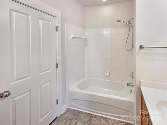 bathroom with vanity and washtub / shower combination