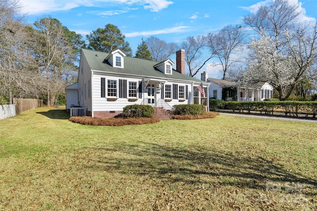 cape cod house featuring a front yard, fence, central AC, and crawl space