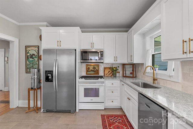 kitchen with a sink, appliances with stainless steel finishes, crown molding, and white cabinetry