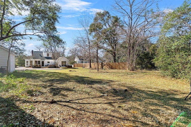 view of yard with fence