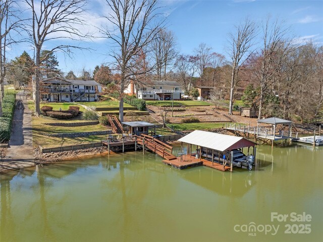 dock area featuring a water view and boat lift
