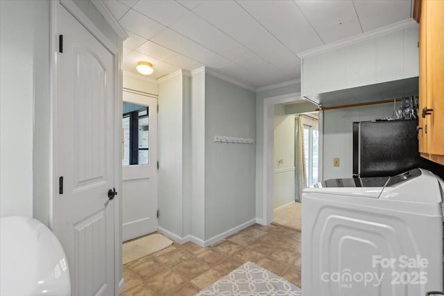 interior space with crown molding, fridge, and independent washer and dryer