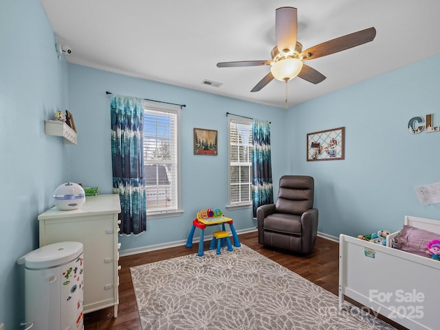 game room with visible vents, baseboards, a ceiling fan, and wood finished floors