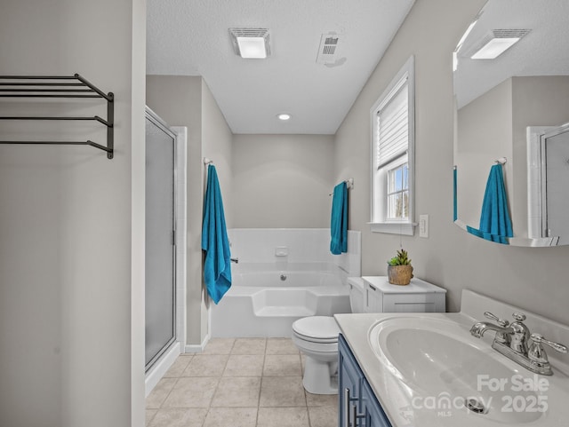 bathroom featuring vanity, a shower stall, a bath, and tile patterned floors