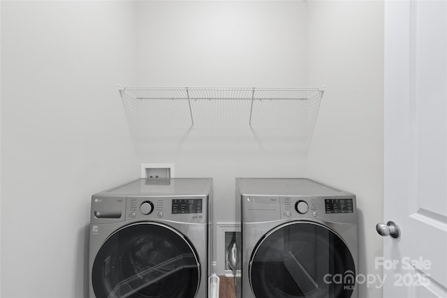 laundry room featuring laundry area and washing machine and dryer