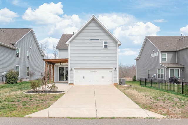 view of front facade with a garage, a front lawn, central AC, and fence