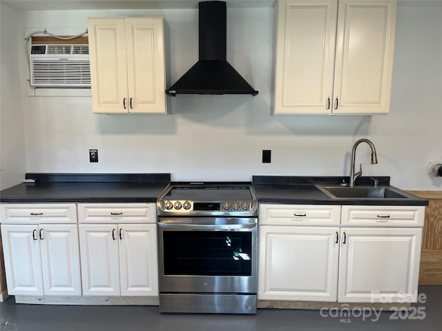 kitchen featuring a sink, dark countertops, white cabinetry, wall chimney range hood, and stainless steel electric range oven