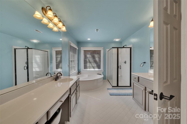 full bathroom featuring a sink, visible vents, two vanities, and a stall shower