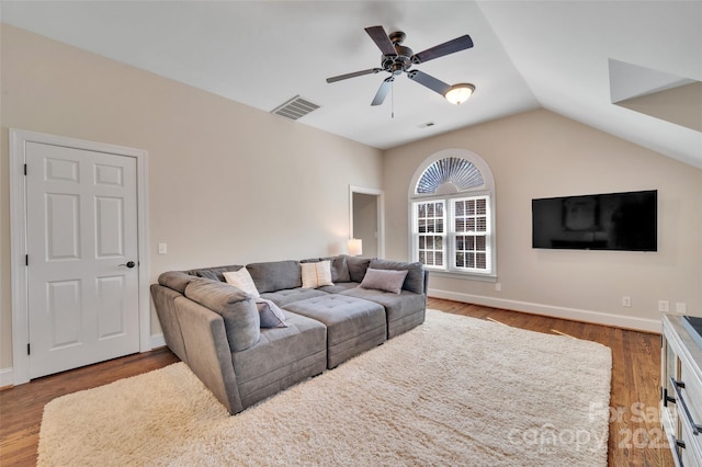 living area with visible vents, wood finished floors, baseboards, lofted ceiling, and ceiling fan