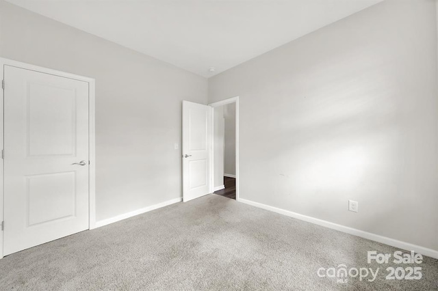 unfurnished bedroom featuring baseboards and carpet floors