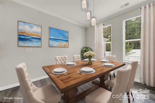 dining room featuring crown molding, baseboards, visible vents, and dark wood-style flooring