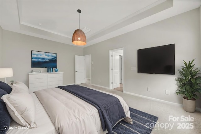 bedroom featuring a tray ceiling, baseboards, carpet, and visible vents