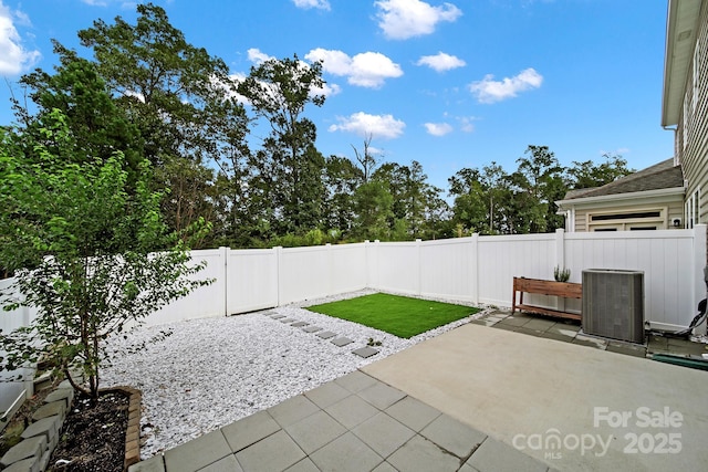 view of patio with central AC unit and a fenced backyard