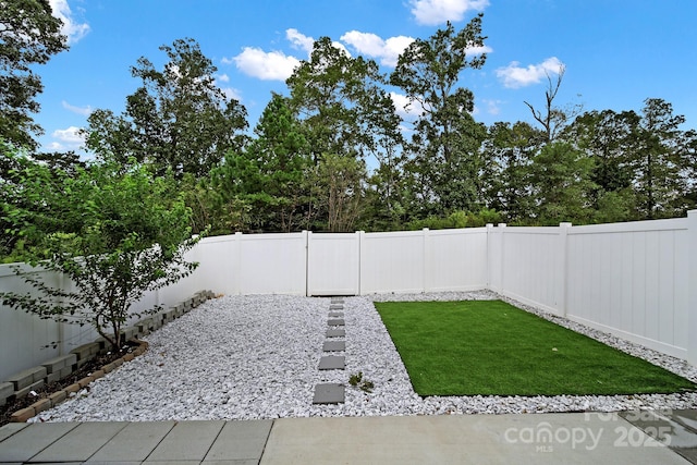 view of yard featuring a fenced backyard