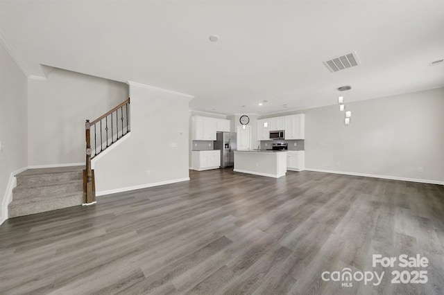 769 River Park Rd, Belmont, NC 28012 - unfurnished living room with stairs, wood finished floors, and baseboards