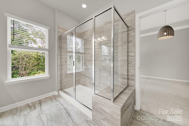 769 River Park Rd, Belmont, NC 28012 - bathroom featuring healthy amount of natural light, a stall shower, baseboards, and marble look tiles
