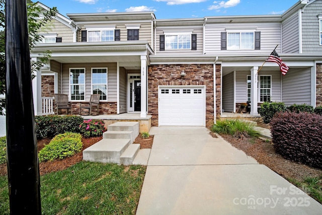 769 River Park Rd, Belmont, NC 28012 - view of front of home with a porch, an attached garage, driveway, and stone siding