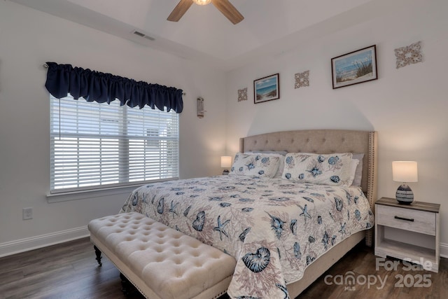 bedroom with visible vents, ceiling fan, baseboards, and wood finished floors