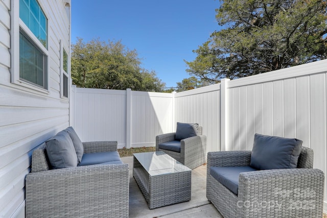 view of patio / terrace featuring an outdoor living space and a fenced backyard