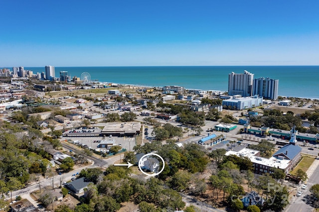 aerial view featuring a view of city and a water view