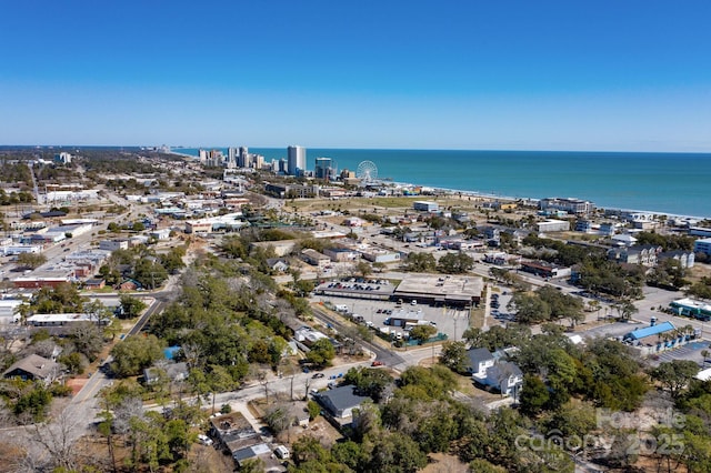 drone / aerial view with a city view and a water view