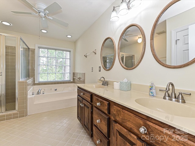 full bathroom featuring tile patterned floors, a garden tub, ceiling fan, and a sink