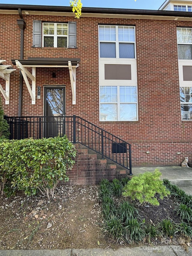 view of front of house with brick siding