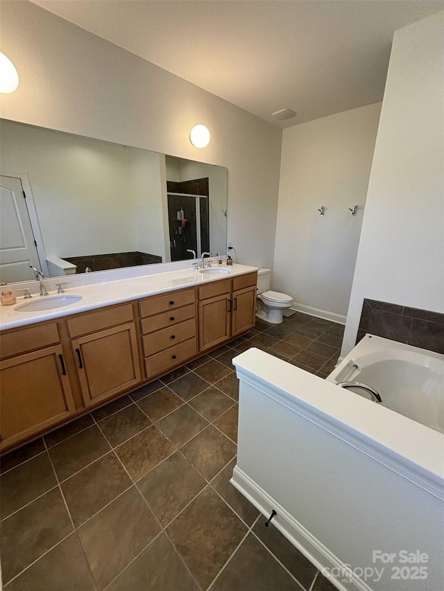 full bath with a sink, double vanity, a bath, and a shower stall