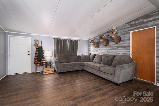 living room featuring lofted ceiling and wood finished floors