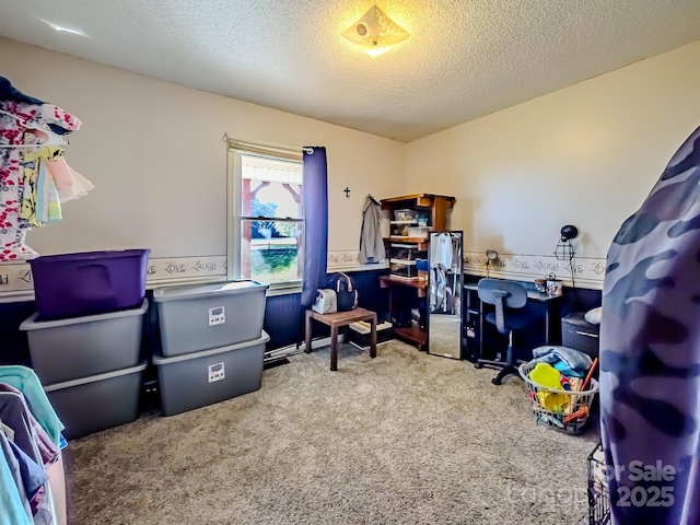 office with carpet flooring and a textured ceiling