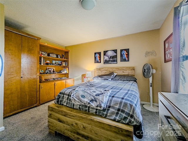 carpeted bedroom with a textured ceiling