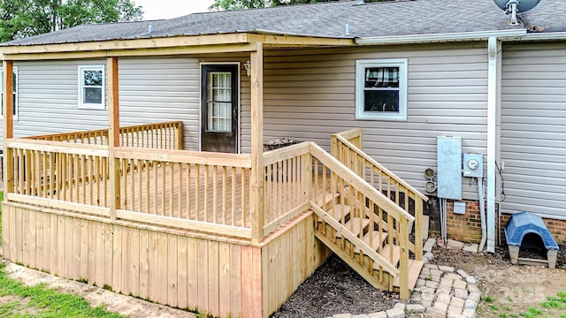 wooden deck featuring stairs